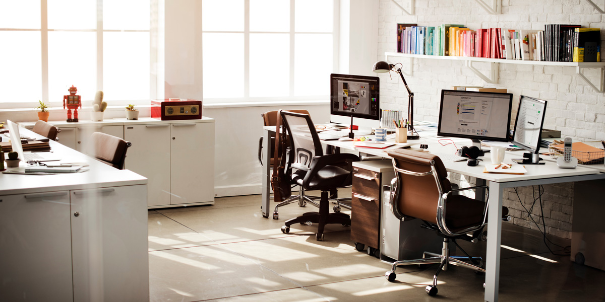 A white office with computers and used office furniture in El Paso.